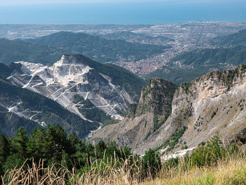 View of the marble quarries of carrara, the paths carved into the side of the mountain 