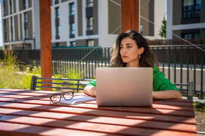 Young woman using laptop at home