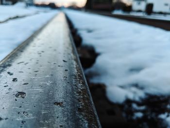 Close-up of snow on railroad track