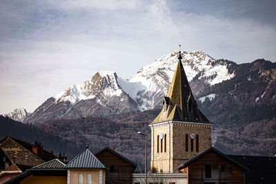 Traditional building against sky during winter