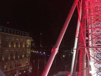 Low angle view of illuminated buildings at night