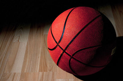 Close-up of basketball on hardwood floor