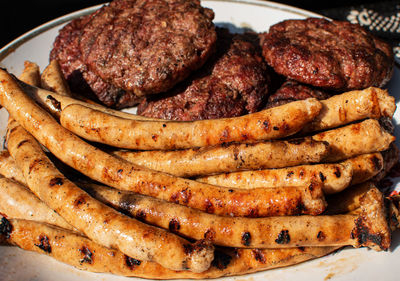 High angle view of meat on barbecue grill