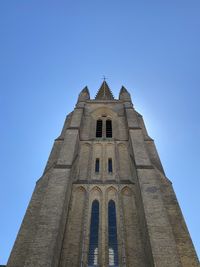 Low angle view of historic building against clear blue sky