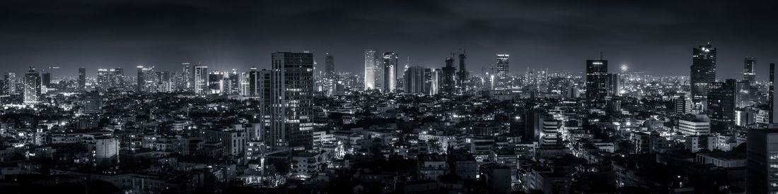 Panoramic view of city at night