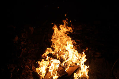 Close-up of bonfire on field at night