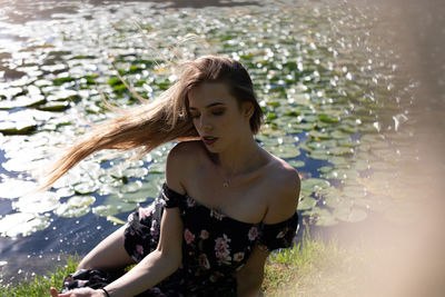 Young woman standing in water