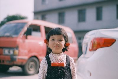 Portrait of cute girl standing in bus