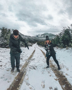 Full length of man standing on snow