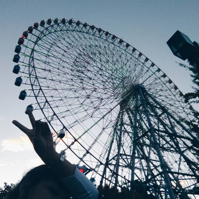 LOW ANGLE VIEW OF FERRIS WHEEL AT NIGHT