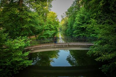 Bridge over canal against sky