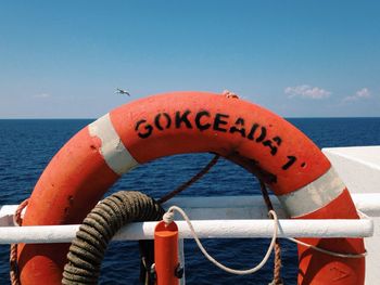 Boats in sea against clear sky