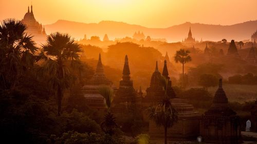 Panoramic view of temple against sky during sunset