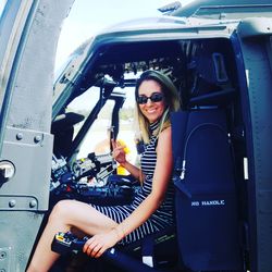 Smiling woman sitting in cockpit