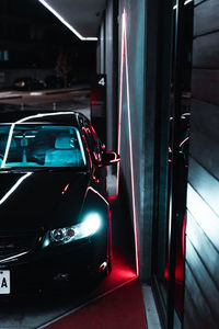 Reflection of illuminated car on windshield