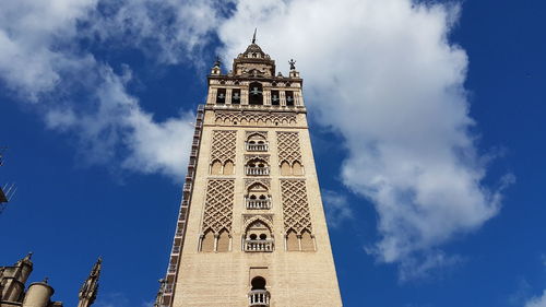 Low angle view of clock tower against sky