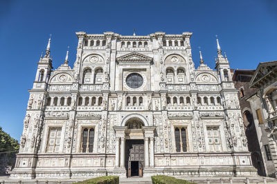 Low angle view of historical building against clear blue sky