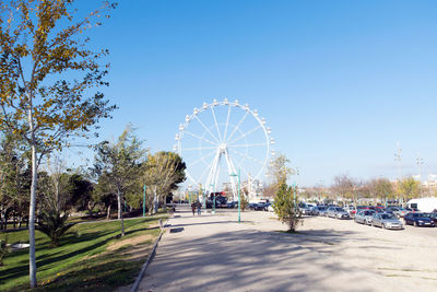 Ferris wheel against clear blue sky