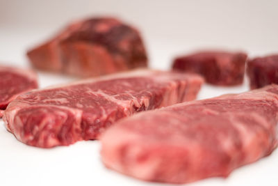 Close-up of meat on white background