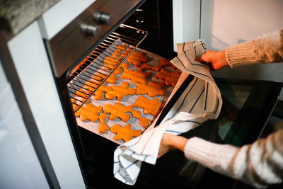 High angle view of man preparing food on table