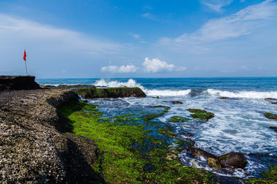 Scenic view of sea against blue sky