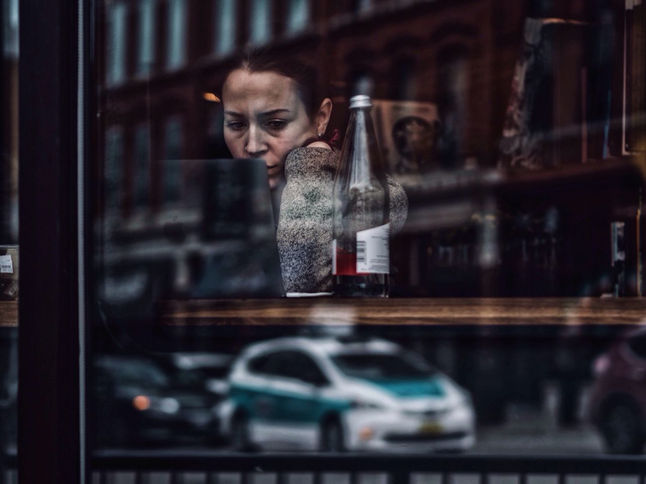 reflection, indoors, window, one person, lifestyles, holiday - event, real people, store window, night, people