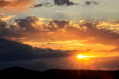 Scenic view of dramatic sky during sunset