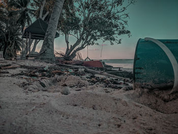 Scenic view of beach by sea against sky