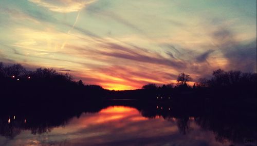 Scenic view of lake against sky during sunset