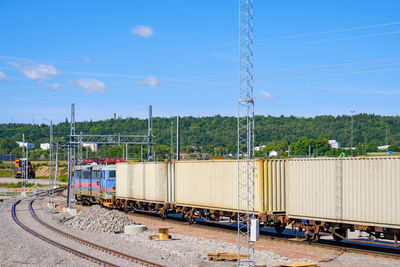 Train on railroad track against sky