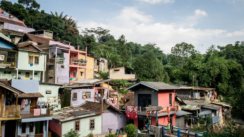 Houses in town against sky