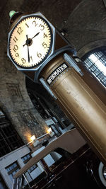 Low angle view of illuminated clock