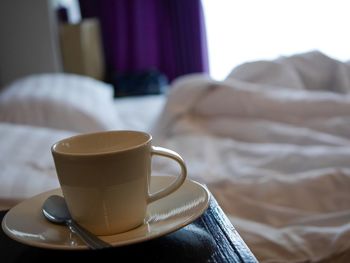 Close-up of coffee cup on table