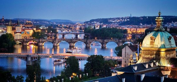 High angle of arch bridges in city at dusk