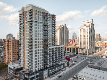 Modern buildings in city against sky