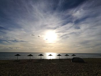 Scenic view of beach against sky during sunset