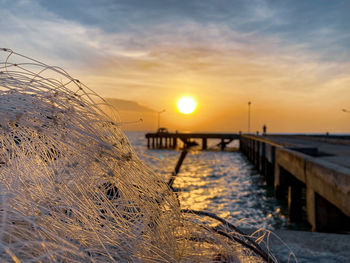 Close-up of sea against sky during sunset