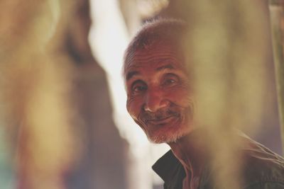 Close-up portrait of smiling senior man