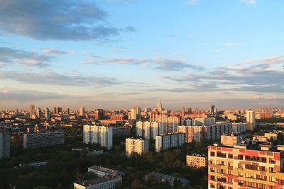 Cityscape against cloudy sky