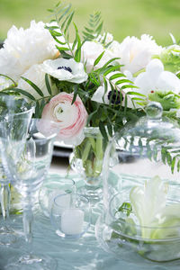 Close-up of white roses in vase on table