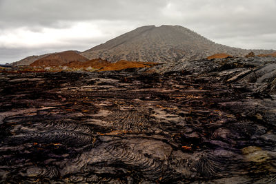 Aerial view of volcanic landscape against sky