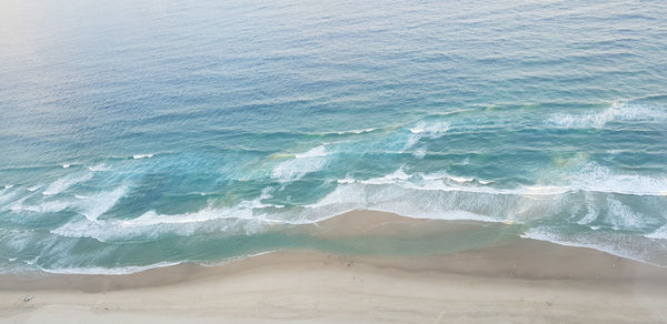 High angle view of waves on beach