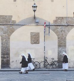 Full length of woman standing by railing