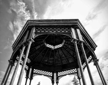 Low angle view of eiffel tower against cloudy sky