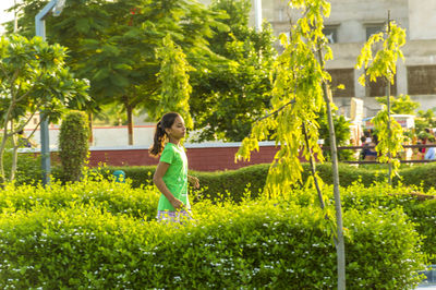 Girl jogging in city public park