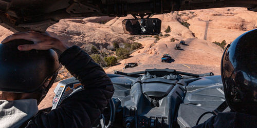 Full frame view of a 4x4 tour in rugged sandstone terrain on a trail called hell's revenge