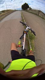 Man riding bicycle on road