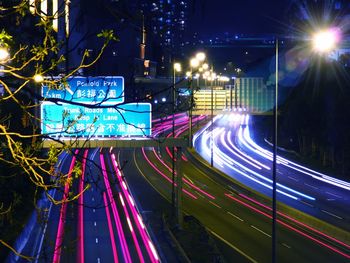 Illuminated city street at night