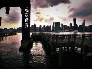 River against cloudy sky at sunset