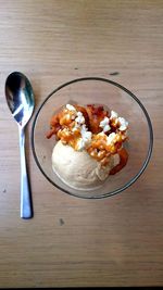 Ice cream served with fried banana and caramel in bowl